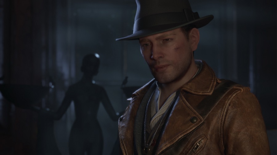 Close-up of Calvin Rafferty in a fedora and leather coat, a shadowy statue looming behind him